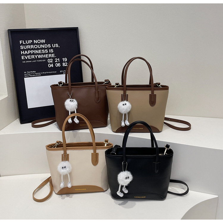 Contrasting color versatile hand-held bucket bag for women's spring simple and high-end niche one-shoulder crossbody bag